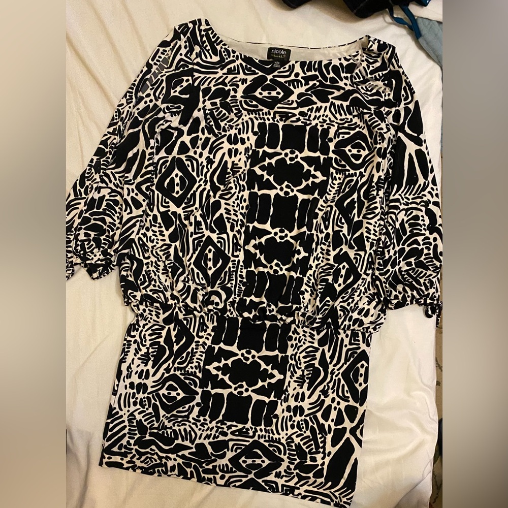 Nicole Miller dress. Flouncy on the top and more fitted in the skirt area